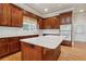 Cherry kitchen cabinetry and white countertops create a charming culinary space at 4385 Old Hamilton Mill Rd, Buford, GA 30518