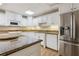 Kitchen with granite countertops, white cabinets, and stainless steel appliances at 4385 Old Hamilton Mill Rd, Buford, GA 30518