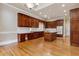 Hardwood kitchen with wooden cabinets and white countertops at 4385 Old Hamilton Mill Rd, Buford, GA 30518