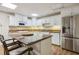 Kitchen with granite countertops, white cabinets, and stainless steel appliances at 4385 Old Hamilton Mill Rd, Buford, GA 30518
