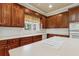 Spacious kitchen features a large island with cooktop and stainless steel appliances at 4385 Old Hamilton Mill Rd, Buford, GA 30518