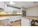 Kitchen with granite countertops, white cabinets, and stainless steel appliances at 4385 Old Hamilton Mill Rd, Buford, GA 30518