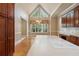 Spacious kitchen features a large island, bright windows, hardwood floors and lots of cabinet space at 4385 Old Hamilton Mill Rd, Buford, GA 30518