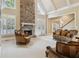 Spacious living room features a stone fireplace and elegant furnishings at 4385 Old Hamilton Mill Rd, Buford, GA 30518