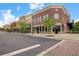 Attractive street view of brick buildings with storefronts and street trees at 4385 Old Hamilton Mill Rd, Buford, GA 30518