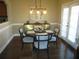 Cozy dining area featuring a modern light fixture, stylish furniture, and access to the outdoors at 11 Reese Way # 11, Avondale Estates, GA 30002