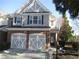 Charming townhome with a brick facade, two-car garage and professionally landscaped front yard at 11 Reese Way # 11, Avondale Estates, GA 30002