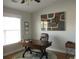 Bright home office with natural light, hard wood floors, and a sophisticated executive desk at 11 Reese Way # 11, Avondale Estates, GA 30002