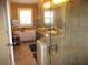 Serene main bathroom showcasing a soaking tub, glass-enclosed shower, and dual vessel sinks at 11 Reese Way # 11, Avondale Estates, GA 30002