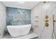 Bathroom featuring an elegant tub inside the glass shower with rain-style showerhead at 1601 Sycamore Nw Dr, Kennesaw, GA 30152