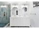 Beautiful bathroom with double vanity, marble shower, and modern fixtures at 1601 Sycamore Nw Dr, Kennesaw, GA 30152