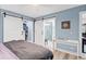 Bedroom featuring a view to the shower, desk, and a barn door closet at 1601 Sycamore Nw Dr, Kennesaw, GA 30152