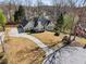 Charming single-Gathering home with a circular driveway, well-manicured lawn, and mature trees at 2973 Heavenly Ln, Snellville, GA 30078