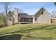 View of the home from the backyard showing the covered deck at 2973 Heavenly Ln, Snellville, GA 30078