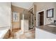 Modern bathroom with a glass-enclosed shower, separate tub, and stylish vanity, offering a spa-like experience at 2973 Heavenly Ln, Snellville, GA 30078