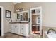 Bathroom view highlighting a vanity, large mirror, and doorway leading to other rooms at 2973 Heavenly Ln, Snellville, GA 30078