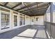 Spacious covered wooden deck with access to the home and yard at 2973 Heavenly Ln, Snellville, GA 30078