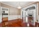 Open concept dining room featuring hardwood floors, contemporary lighting, and access to other rooms at 2973 Heavenly Ln, Snellville, GA 30078