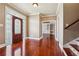 Spacious foyer featuring hardwood flooring, staircase, and front door with leaded glass inserts at 2973 Heavenly Ln, Snellville, GA 30078