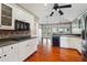 Spacious kitchen with stainless steel appliances, white cabinets, and a view to the backyard at 2973 Heavenly Ln, Snellville, GA 30078
