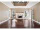 Welcoming living room with a fireplace, hardwood floors, and plenty of natural light, offering a cozy space at 2973 Heavenly Ln, Snellville, GA 30078