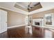 Cozy living room with a fireplace, hardwood floors, and plenty of natural light, creating a relaxing atmosphere at 2973 Heavenly Ln, Snellville, GA 30078