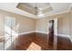 Spacious main bedroom with a tray ceiling, ceiling fan, and ample closet space, a perfect retreat at 2973 Heavenly Ln, Snellville, GA 30078