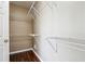 Bright walk-in closet features hardwood floors and multiple shelves at 2973 Heavenly Ln, Snellville, GA 30078