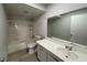 Comfortable bathroom with shower-tub combination, updated vanity and standard toilet at 3156 Nectarine Cir, Decatur, GA 30034