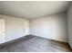 Spacious bedroom with neutral carpet and a door to the hallway at 3156 Nectarine Cir, Decatur, GA 30034