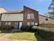 Inviting townhome featuring a brick facade, cozy front yard, and well-maintained landscaping at 3156 Nectarine Cir, Decatur, GA 30034