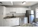 Bright kitchen with new stainless steel fridge and sink at 3156 Nectarine Cir, Decatur, GA 30034