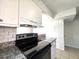 Close up of the new black range stove and countertops at 3156 Nectarine Cir, Decatur, GA 30034