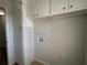 A functional laundry area with storage cabinets and utility connections at 3156 Nectarine Cir, Decatur, GA 30034