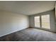Light-filled living room with neutral carpet and large windows at 3156 Nectarine Cir, Decatur, GA 30034