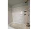 Tub-shower combination with white subway tile surround and chrome fixtures at 3156 Nectarine Cir, Decatur, GA 30034