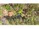 An aerial view of the home and surrounding wooded area, with easy access to the road at 4670 Sundridge Trl, Fairburn, GA 30213