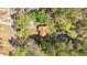 A bird's-eye view of the home nestled among mature trees, offering a sense of privacy and tranquility at 4670 Sundridge Trl, Fairburn, GA 30213