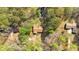 An aerial perspective of the home, showcasing its position amidst lush greenery and neighboring properties at 4670 Sundridge Trl, Fairburn, GA 30213