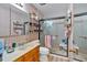 Bathroom featuring a single vanity, toilet, and shower with glass doors at 4670 Sundridge Trl, Fairburn, GA 30213