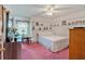 Cozy bedroom with carpet floor, ceiling fan, and decorations at 4670 Sundridge Trl, Fairburn, GA 30213