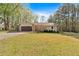 Charming single-story home featuring a two-car garage and a well-maintained front lawn at 4670 Sundridge Trl, Fairburn, GA 30213