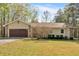 Charming single-story home featuring a two-car garage and a well-maintained front lawn at 4670 Sundridge Trl, Fairburn, GA 30213