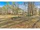 Landscaped front yard with mature trees offering shade and privacy to the home at 4670 Sundridge Trl, Fairburn, GA 30213