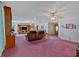 Spacious living room with multiple ceiling fans and ample seating arrangements at 4670 Sundridge Trl, Fairburn, GA 30213