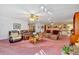 Expansive living room with multiple seating areas and a stone fireplace feature at 4670 Sundridge Trl, Fairburn, GA 30213