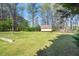 Spacious backyard with a well-maintained lawn and storage shed at 2223 Jay Se Ln, Smyrna, GA 30080