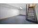 Unfinished basement space with a staircase, ready for customization at 2223 Jay Se Ln, Smyrna, GA 30080