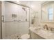 Bright bathroom featuring a glass shower and elegant vanity with a marble countertop at 2223 Jay Se Ln, Smyrna, GA 30080