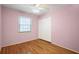 Cozy bedroom with wood floors and a window offering ample natural light at 2223 Jay Se Ln, Smyrna, GA 30080